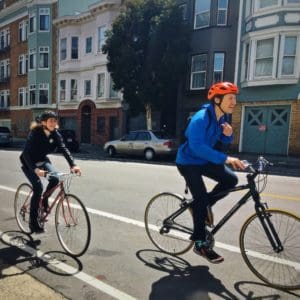 Man and women cycling