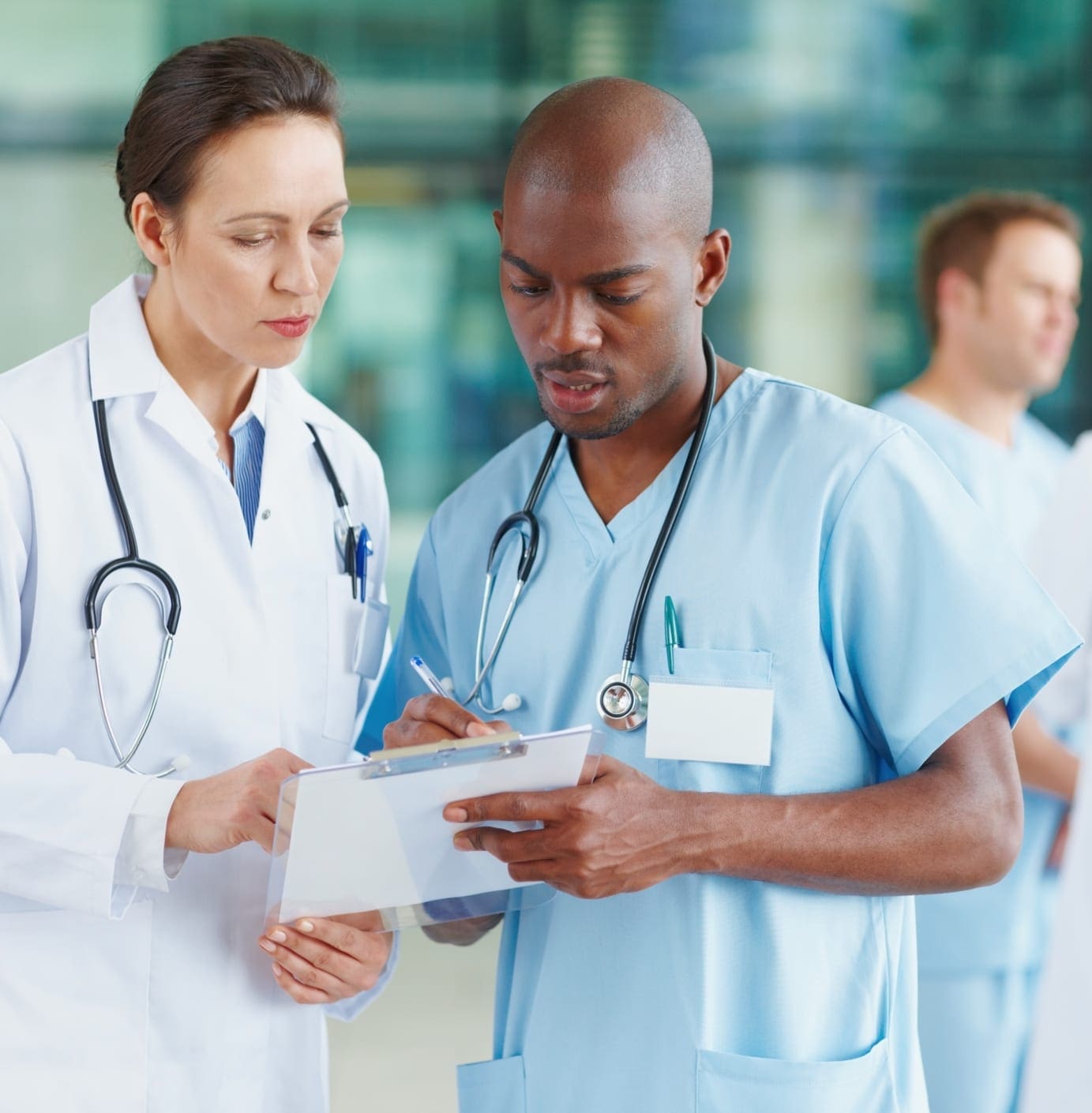 Health care workers reviewing notes