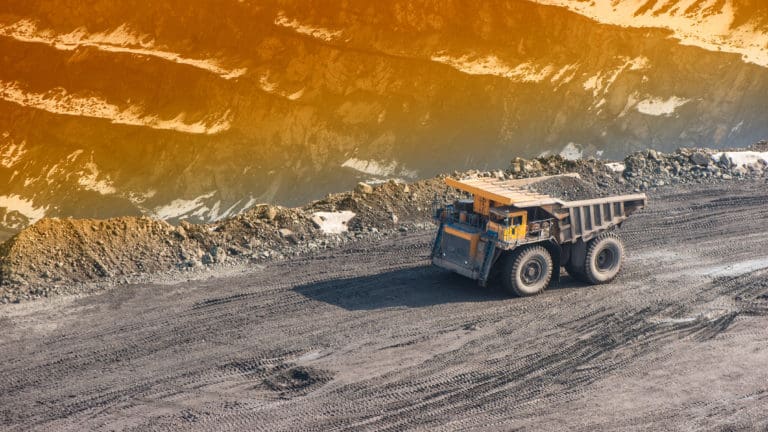Dump trucks and roads to deliver ore and auxiliary cargo career on extraction of iron ore.