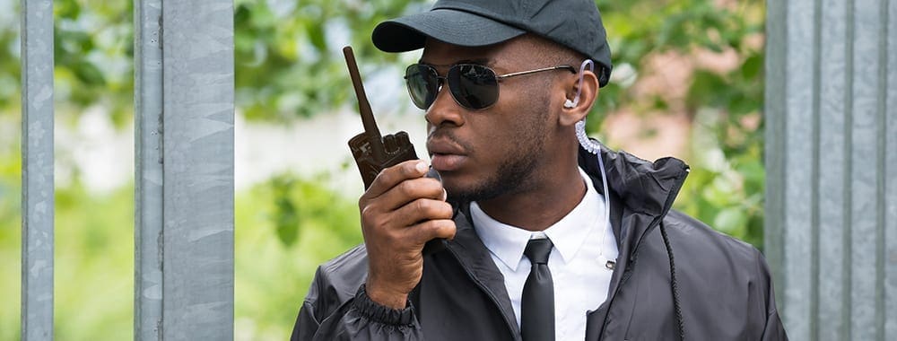 Security team member holding a walkie talkie