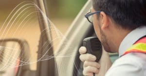 Driver using speaker mic to communicate -Voice-First Collaboration for Transportation