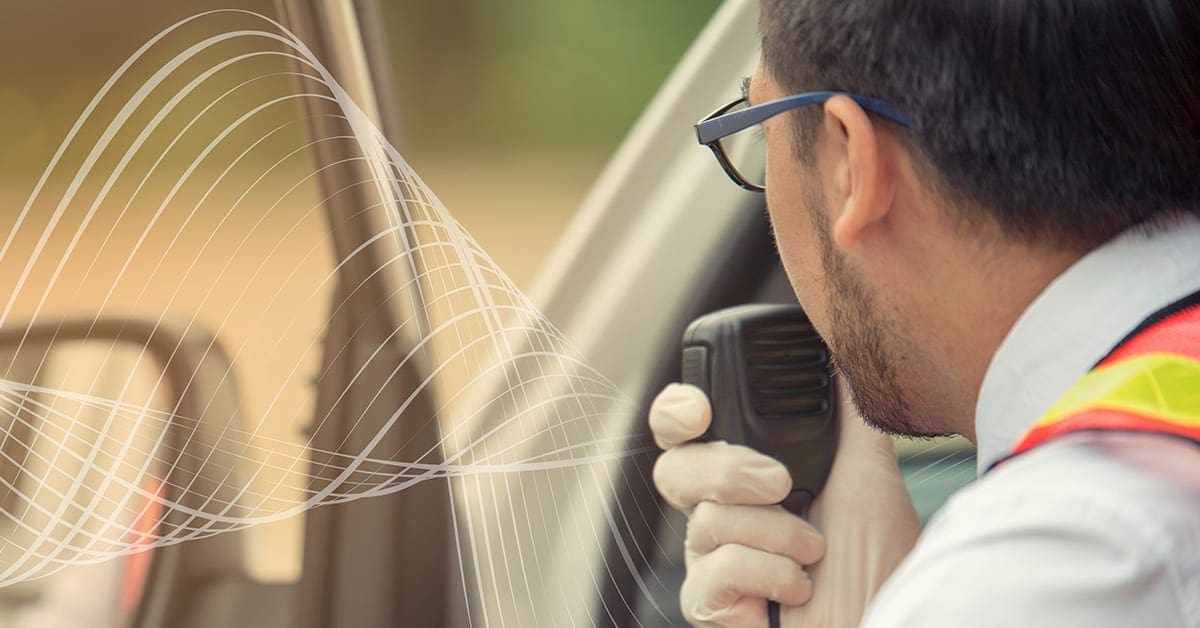 Driver using speaker mic to communicate -Voice-First Collaboration for Transportation