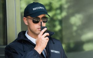 Security teams say they need to upgrade their communication - Security officer with outdated radio