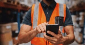 warehouse worker on cell phone radios logistics fail